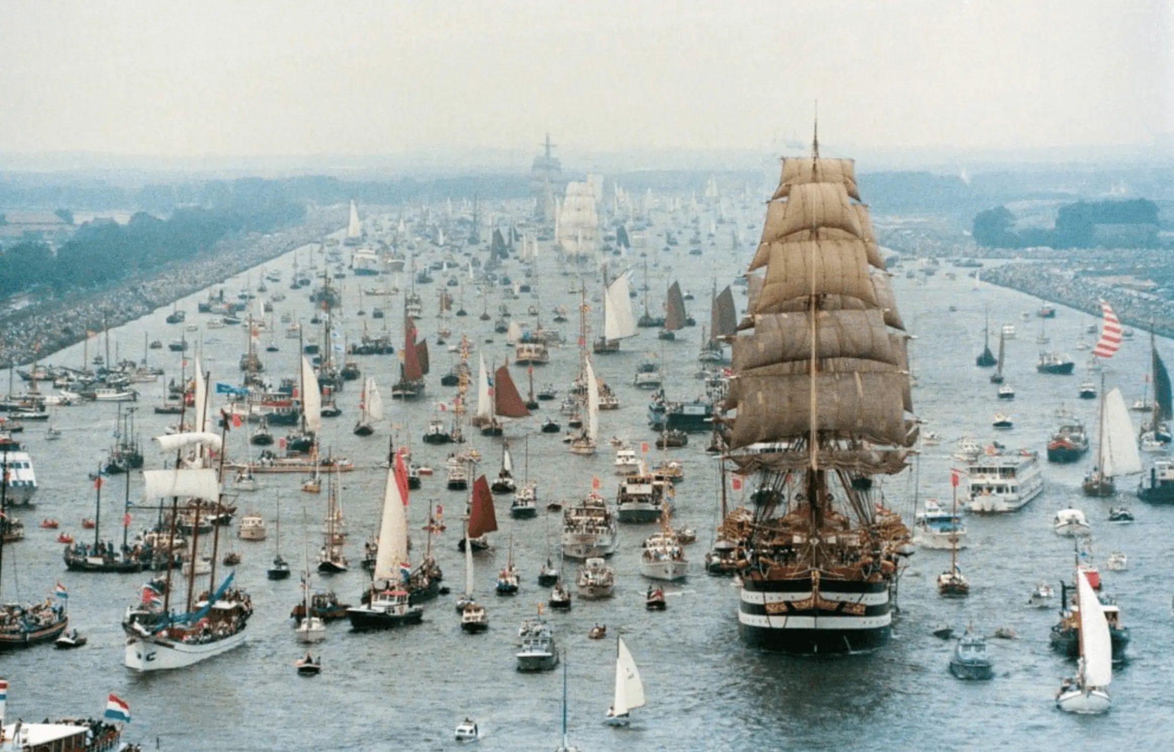 Boats sailing up the IJ river during SAIL 2015